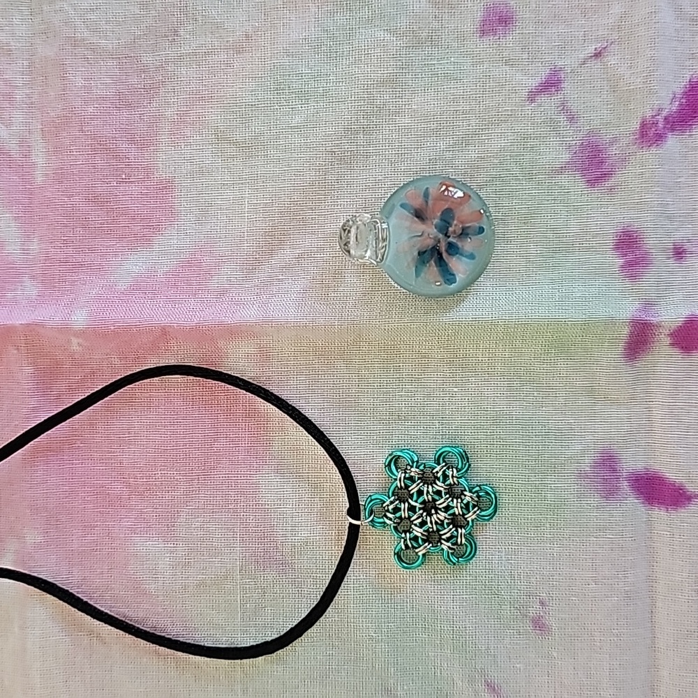 Two handmade necklaces pendants.